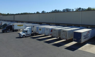 ABW114 warehouse with trailers at the dock doors