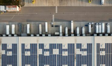 An aerial view of a warehouse and fleet docking bays