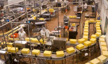 Product moves through a co-packaging line, the kind of make-to-order coordination a growing CPG brand relies on to keep retail orders accurate.