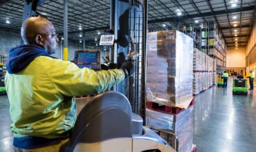 Associate Scanning a Pallet During a 3PL Transition